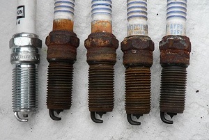 Comparing old and new spark plugs